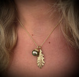 Lille agerntop i 14 karat guld m. grøn Tahitiperle 11 mm. dia.